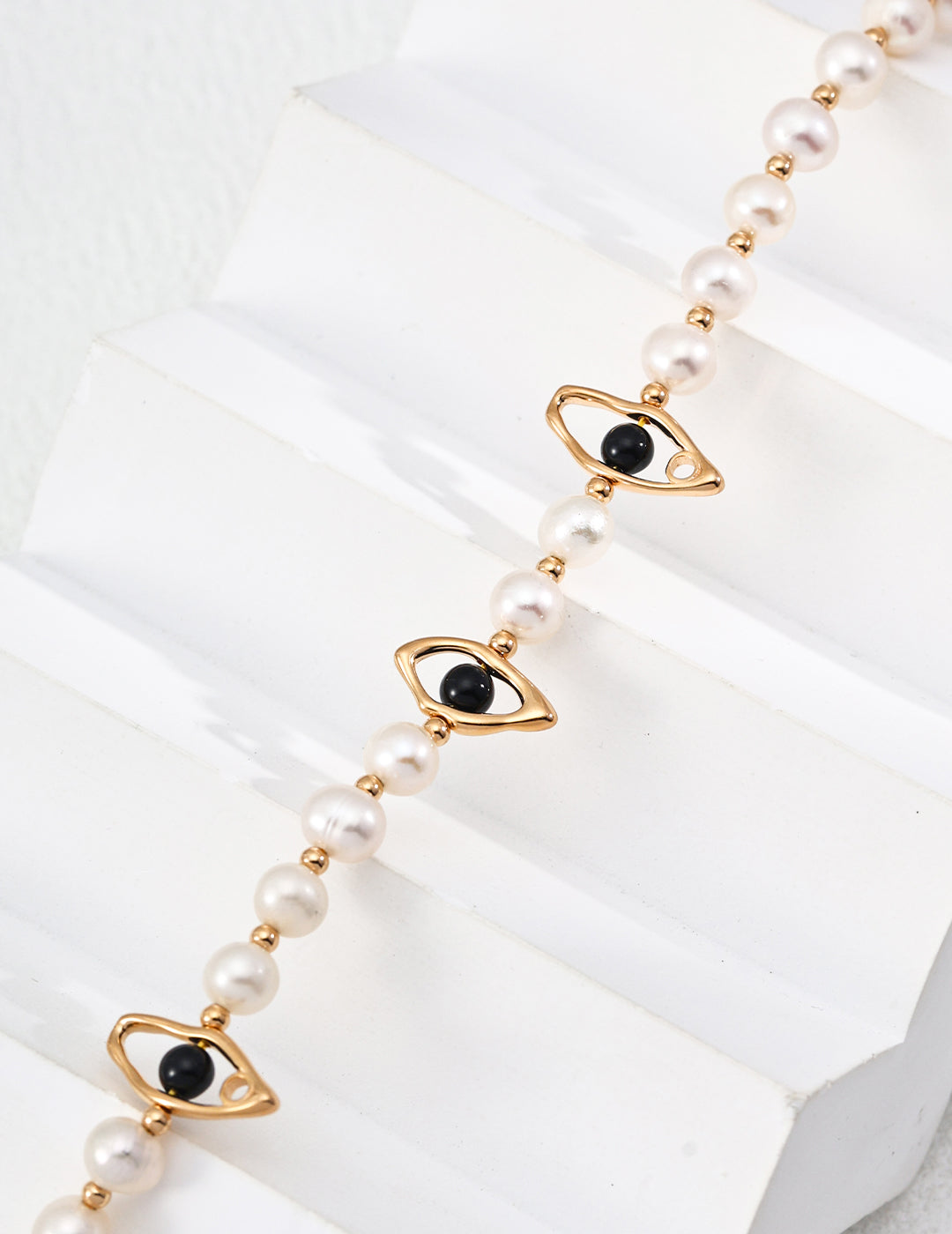 This elegant necklace features a refined combination of natural pearls and black onyx beads, set in S925 silver. With its classic black-and-white palette and graceful design, it's perfect for both formal occasions and sophisticated everyday wear.
