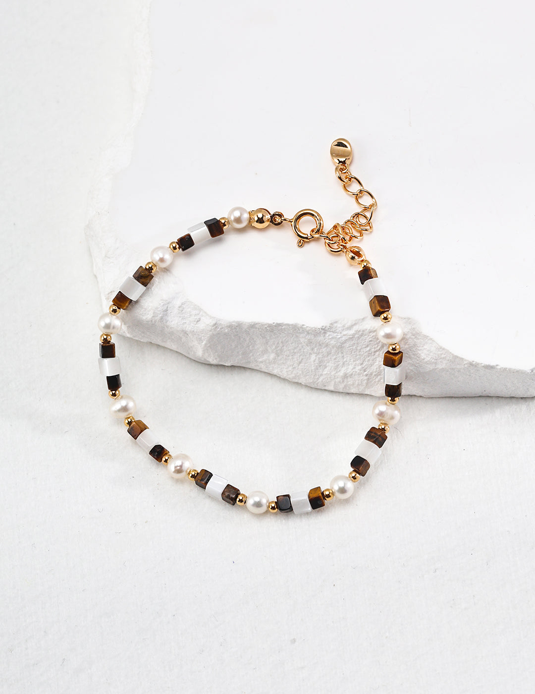 Elegant silver beaded bracelet featuring natural tiger eye gemstones, known for boosting confidence, focus, and protection — a stylish spiritual accessory perfect for grounding energy and everyday wear