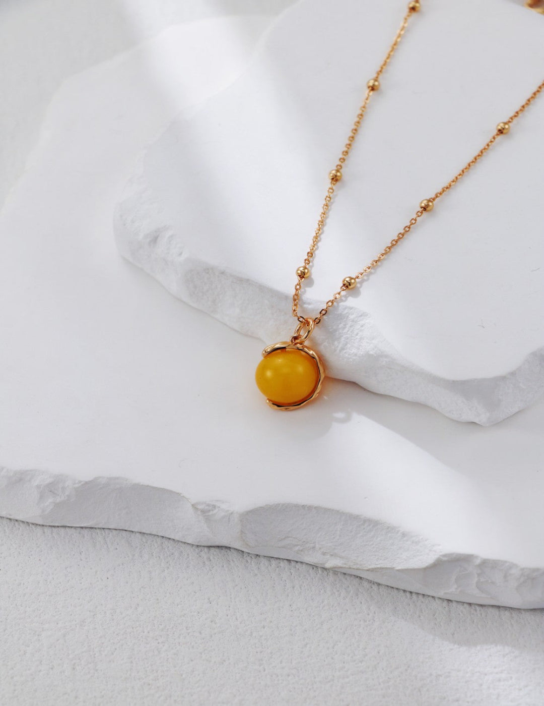 Handmade S925 silver necklace with vintage gold detailing and a warm honey amber pendant, ideal for boho and retro jewelry lovers