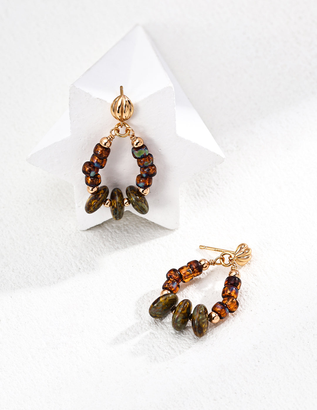 These handcrafted earrings feature shimmering iridescent glass beads set in S925 silver, offering a delicate balance of sparkle and sophistication. Perfect for everyday wear or special occasions, they’re ideal for those who appreciate minimalist elegance and artisanal craftsmanship.
