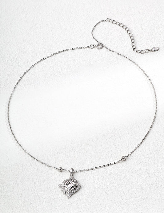 This handcrafted S925 silver necklace features a radiant mother of pearl centerpiece, accented with sparkling zircon stones. Its minimalist yet refined design makes it ideal for adding a subtle touch of elegance to both everyday and formal outfits.