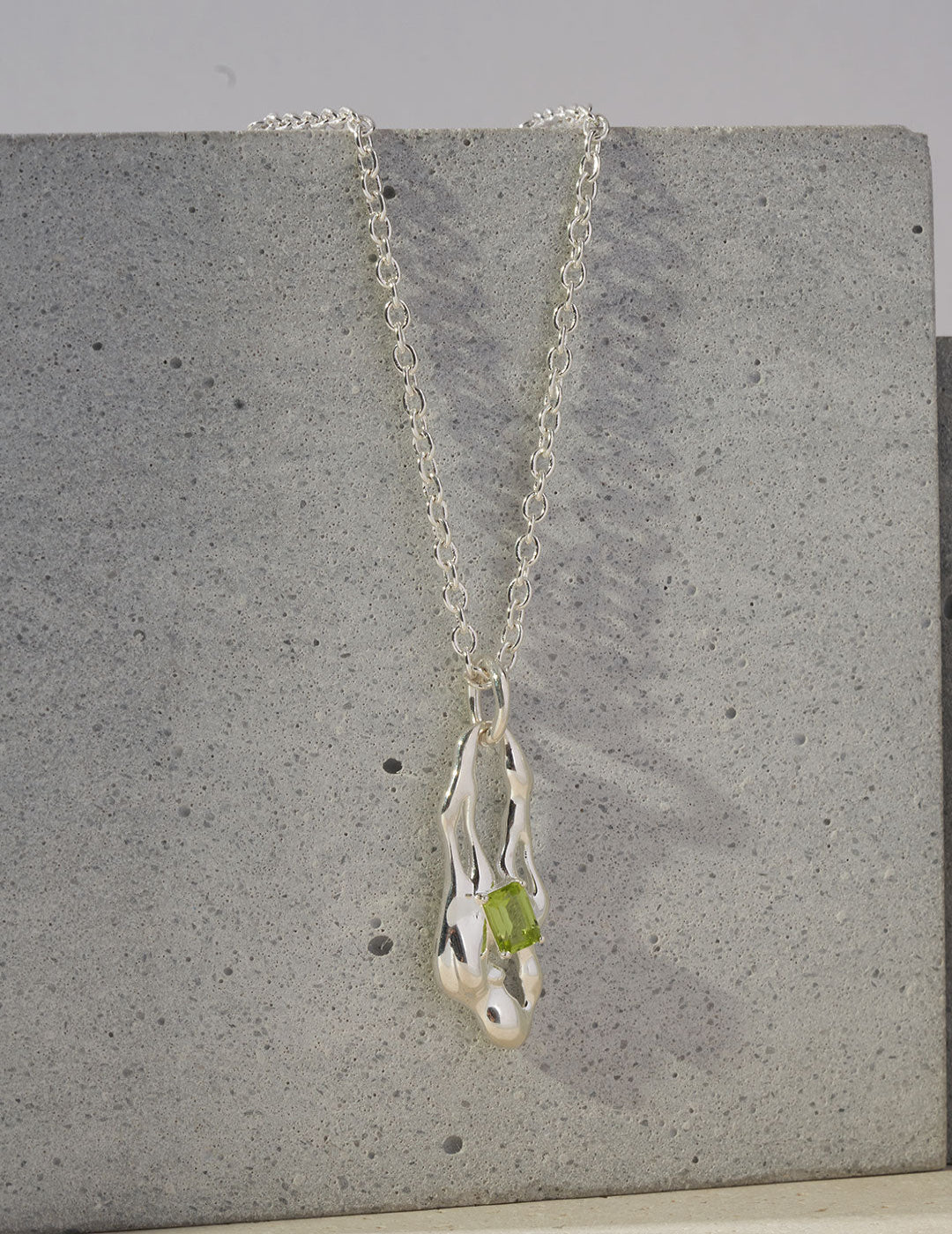 This necklace features a natural peridot gemstone in a minimalist setting, offering a fresh pop of green with refined elegance. Set on a delicate chain, it’s perfect for everyday wear, layering, or as a thoughtful August birthstone gift.