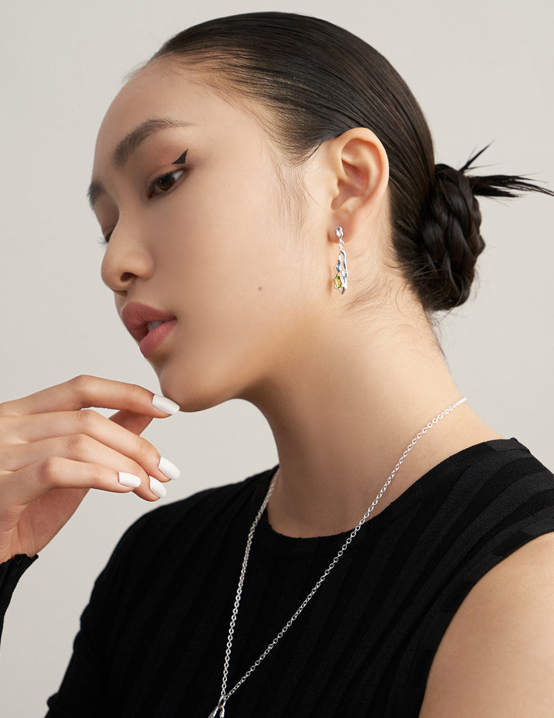 These earrings feature natural peridot gemstones with a fresh green glow, offering a clean and timeless look. Perfect for adding a subtle pop of color to both casual and formal outfits, they’re a beautiful choice for everyday wear or as a thoughtful August birthstone gift.