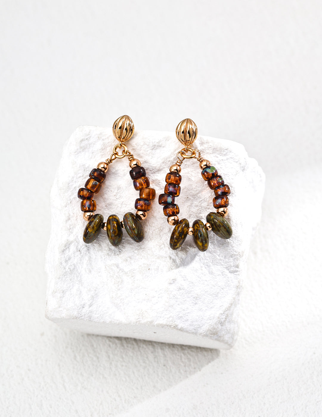 These S925 silver drop earrings feature shimmering iridescent glass beads in a vintage-inspired design. Their soft glow and retro elegance make them a perfect accessory for adding a touch of timeless beauty to any outfit. Ideal for lovers of nostalgic, handcrafted jewelry with a modern twist.