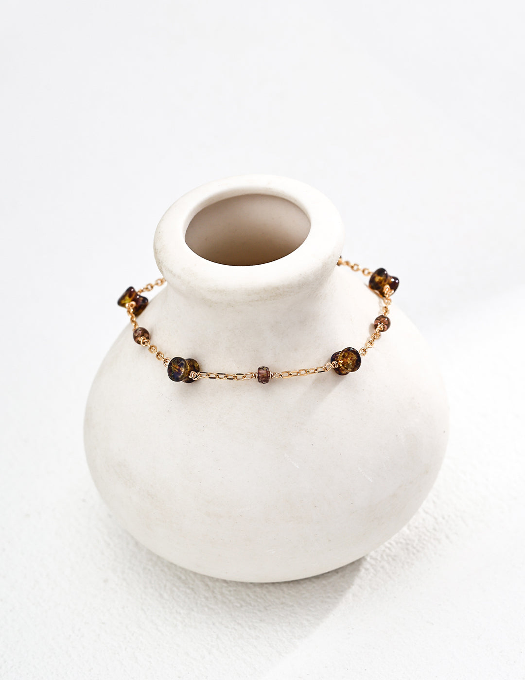 This minimalist bracelet features smooth glass beads on a fine S925 silver chain, offering a clean and modern look. Its simple elegance makes it perfect for daily wear, layering, or gifting. Designed for those who love subtle, handcrafted jewelry with a contemporary touch.