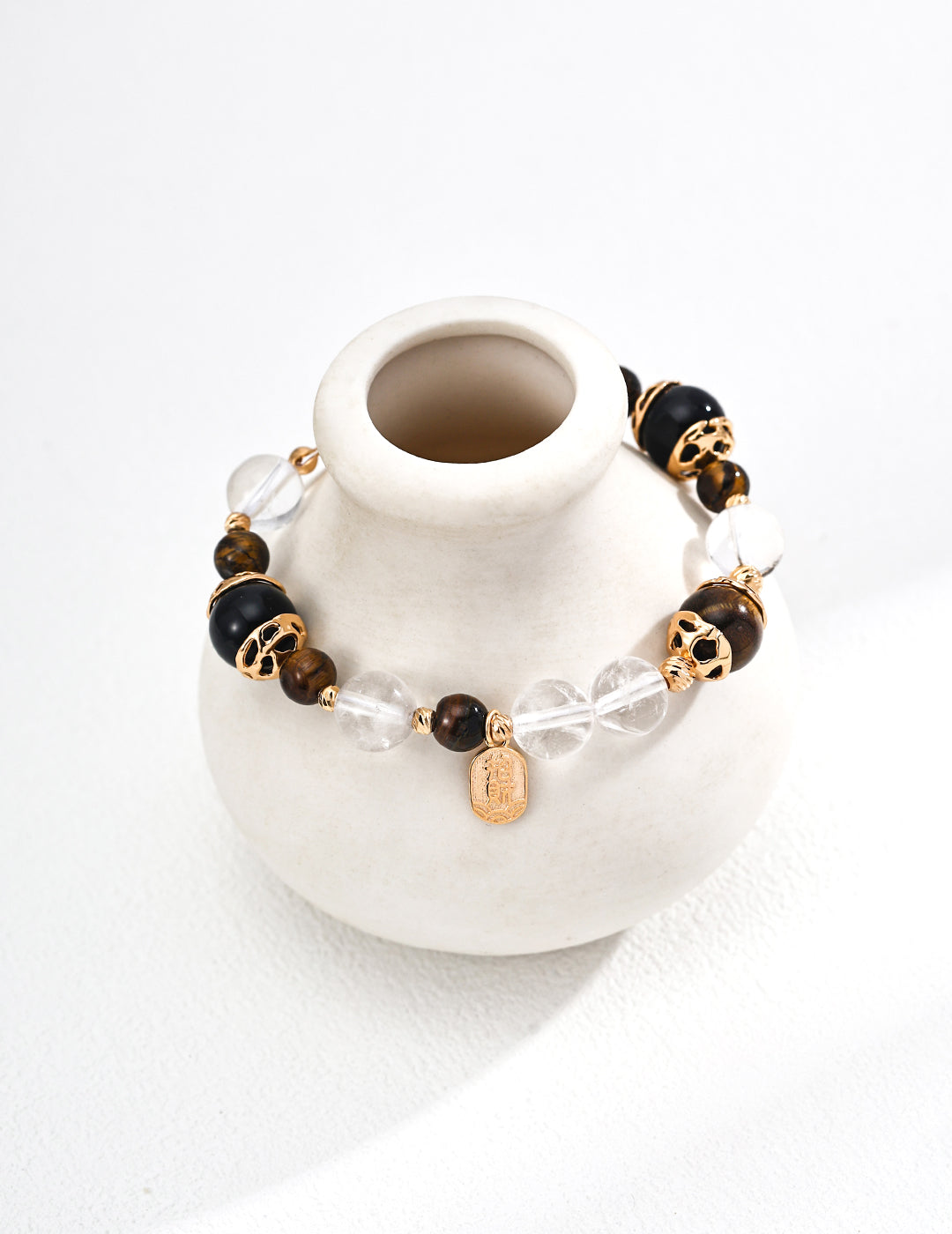 S925 silver bracelet featuring natural tiger eye and black onyx gemstones, known for grounding energy, protection, and confidence — a handcrafted spiritual accessory ideal for everyday wear and energy healing practices