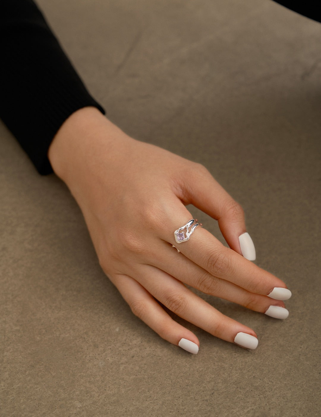 This sterling silver ring features a beautiful amethyst gemstone, offering an elegant design that adds a pop of color to any outfit. The rich purple hue of the amethyst is complemented by the sleek sterling silver band, creating a sophisticated look suitable for both casual and formal occasions. Ideal for those who appreciate high-quality, handcrafted jewelry with a timeless appeal.