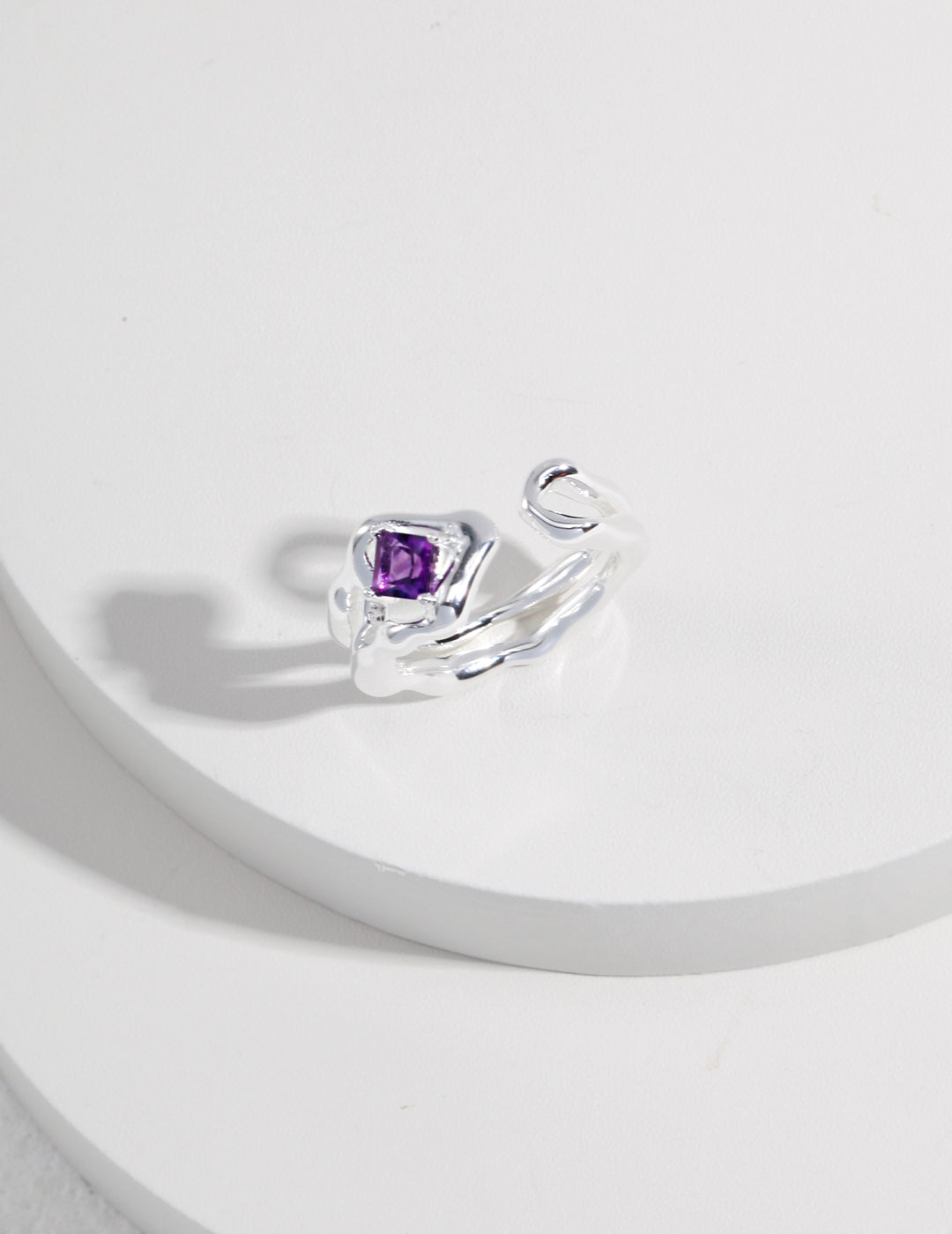 This sterling silver ring features a stunning purple quartz gemstone, offering an elegant and sophisticated design. The rich purple hue of the quartz adds a vibrant touch to the sleek sterling silver band, making it a perfect accessory for both casual and formal occasions. Ideal for those who appreciate high-quality, handcrafted jewelry with a modern, yet timeless appeal.