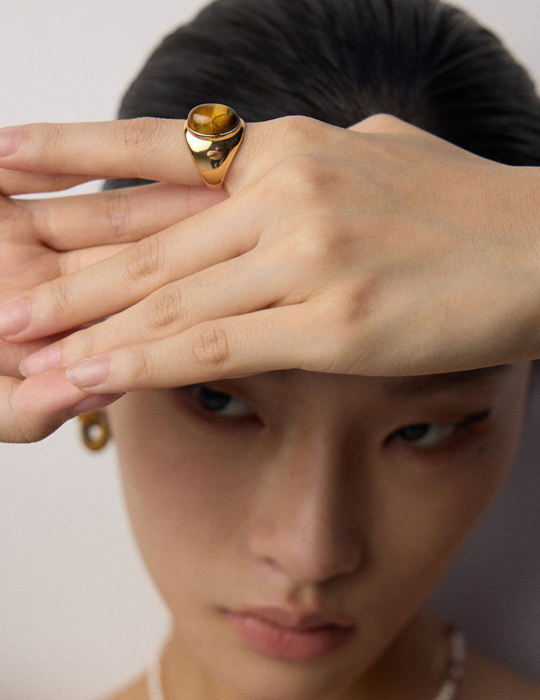 Sterling silver ring featuring a striking tiger eye stone, ideal for those who love bold, earthy designs.