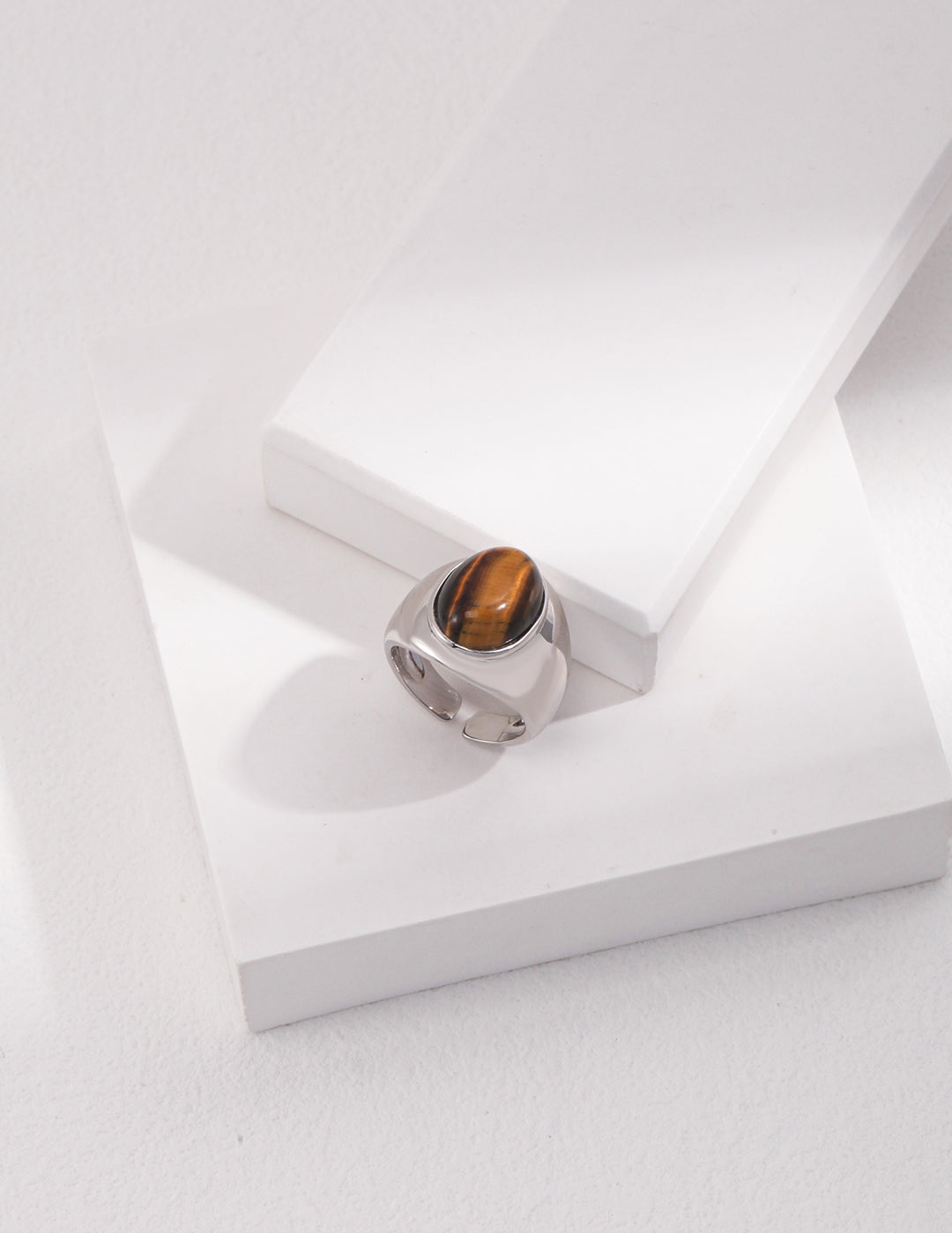 Sterling silver ring showcasing a beautiful tiger's eye stone, perfect for a unique, nature-inspired accessory.