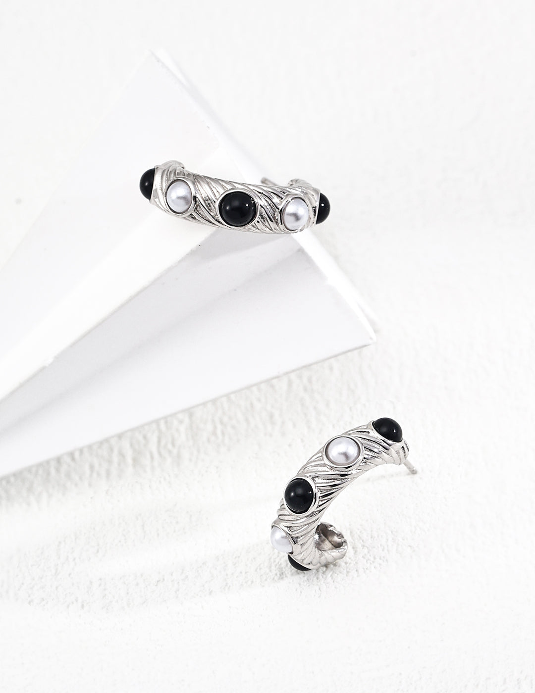 Handcrafted sterling silver earrings with pearl and black onyx stones