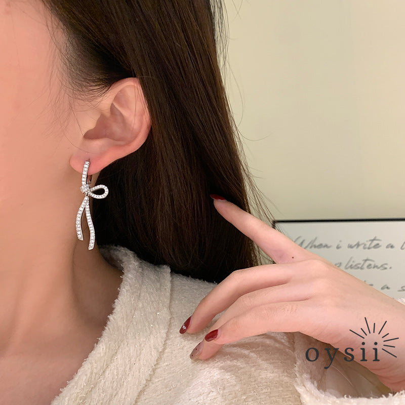 Starlit Grace – Diamond Bow Ribbon Earrings