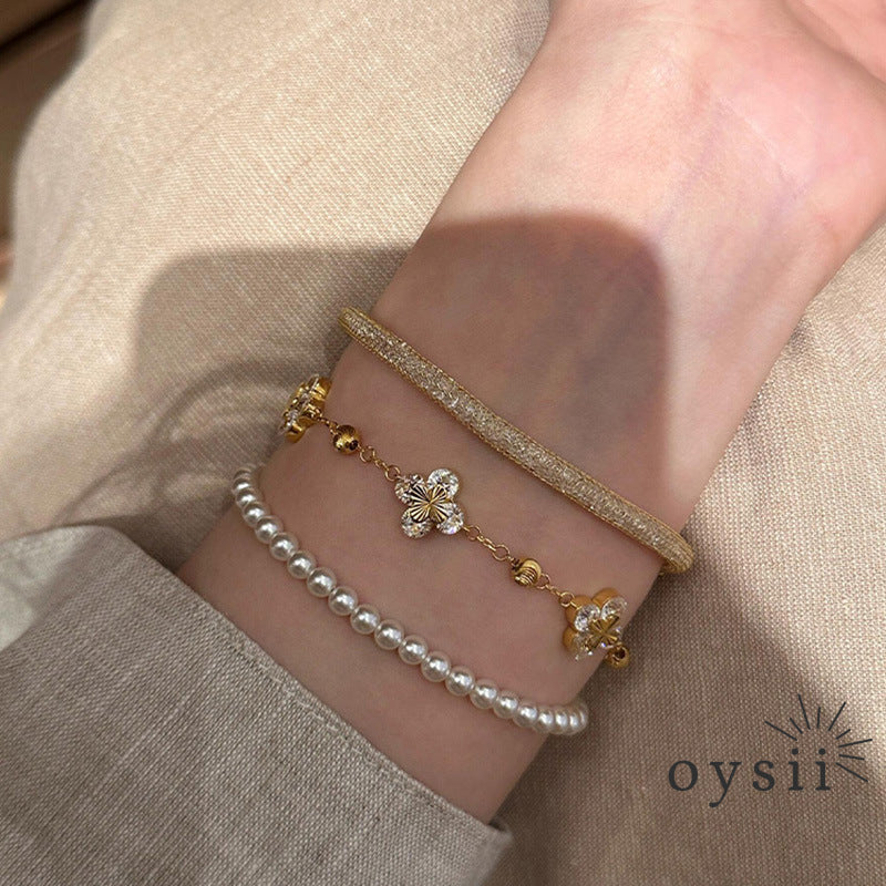 Golden Frost — Laser-Cut Four-Leaf Clover Bracelet