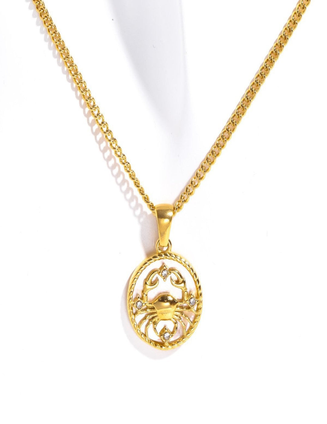 Cancer zodiac sign pendant with delicate constellation engraving, astrology-themed jewelry gift idea.
