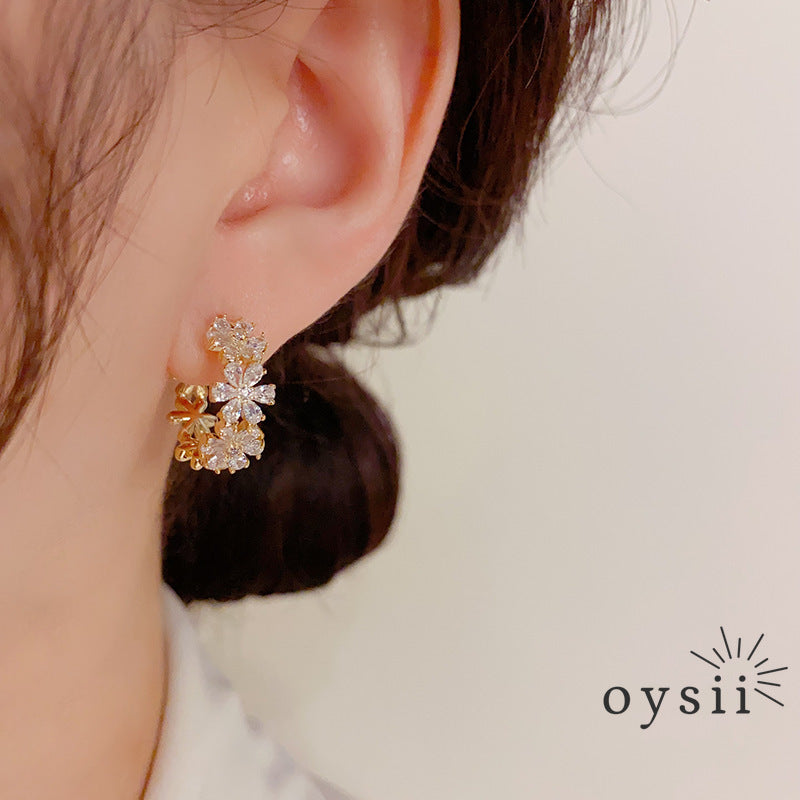 Whispering Petals — Zircon Flower Ear Cuffs