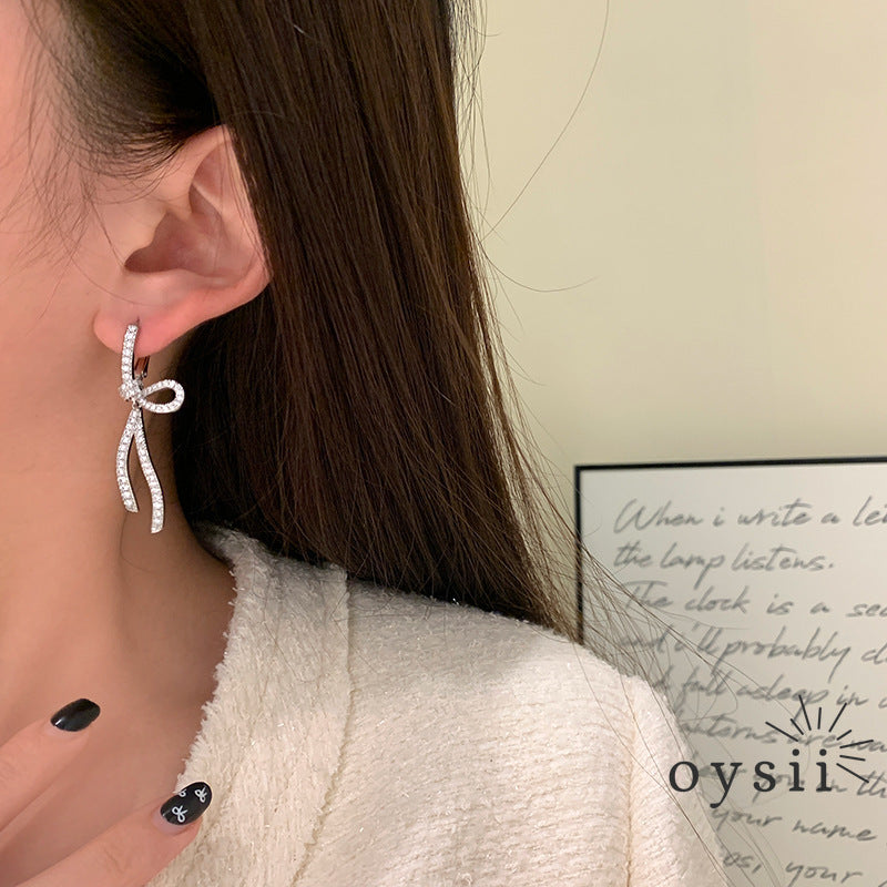 Starlit Grace – Diamond Bow Ribbon Earrings