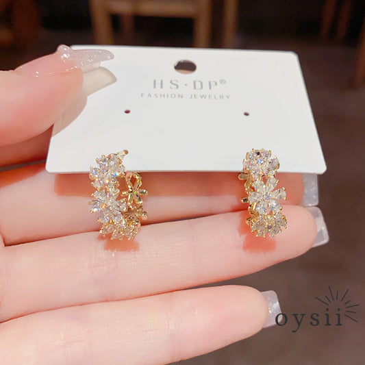 Whispering Petals — Zircon Flower Ear Cuffs