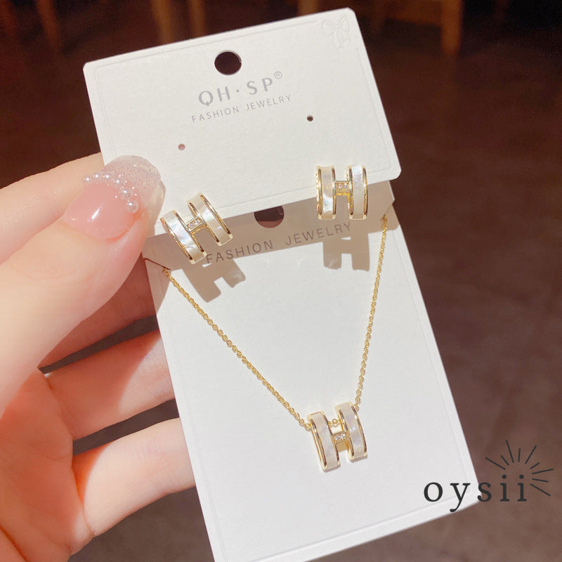 Hermes Whisper — Mother-of-Pearl Initial Stud Earrings