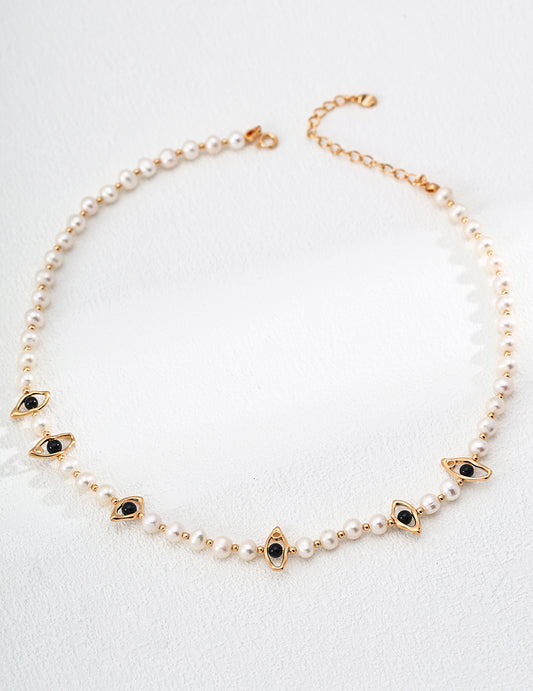 This handcrafted necklace combines the classic beauty of pearls with the bold contrast of black onyx beads, all set on S925 silver. Its elegant black-and-white palette makes it a timeless piece perfect for both everyday wear and formal occasions.