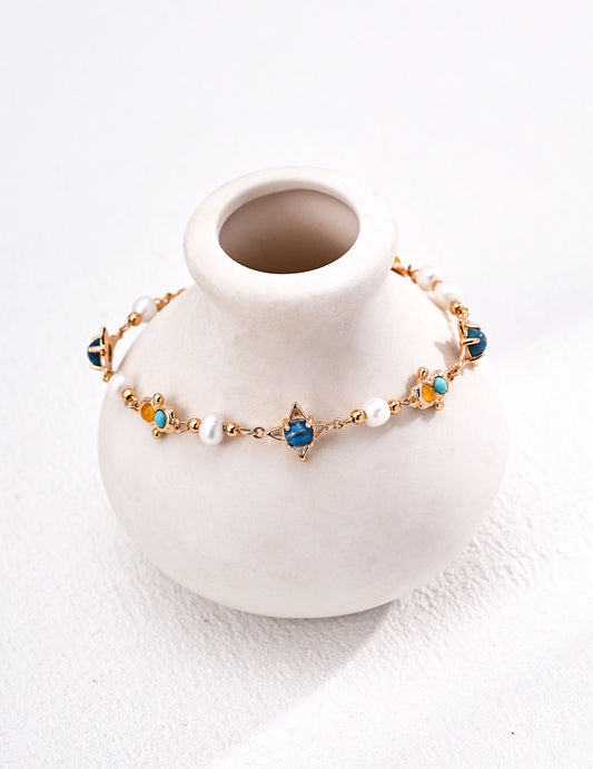 This S925 silver retro bracelet features a stunning combination of natural pearls, turquoise, and chalcedony, creating a vintage-inspired design with vibrant colors. The intricate blend of gemstones adds a unique and elegant touch to this bracelet, perfect for both casual and formal occasions. Ideal for those who appreciate high-quality, handcrafted jewelry with a timeless, nature-inspired appeal.