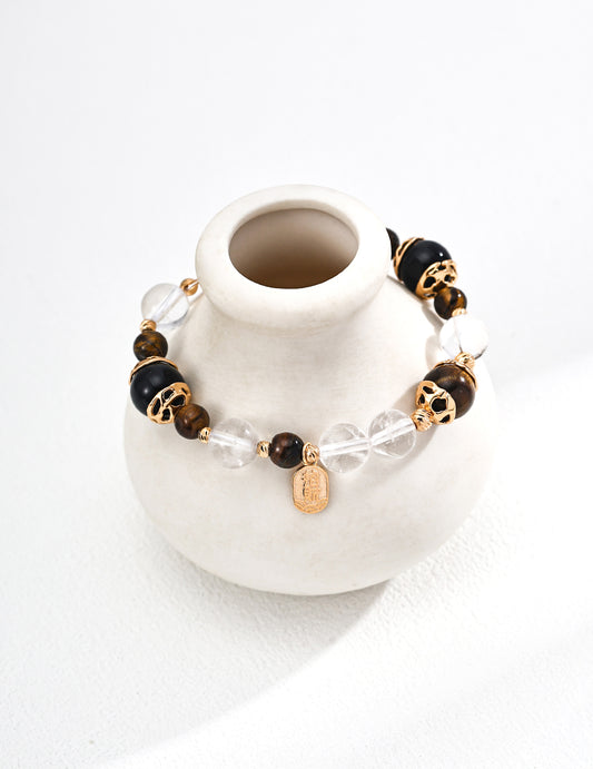 S925 silver bracelet featuring natural tiger eye and black onyx gemstones, known for grounding energy, protection, and confidence — a handcrafted spiritual accessory ideal for everyday wear and energy healing practices
