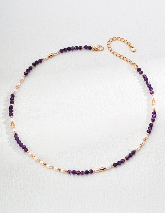 This S925 silver necklace features a beautiful combination of natural pearls and amethyst, creating a vintage-inspired and elegant design. The lustrous natural pearls are perfectly complemented by the rich purple hue of amethyst, making this necklace ideal for both casual and formal occasions. Perfect for those who appreciate high-quality, handcrafted jewelry with timeless beauty and sophistication.