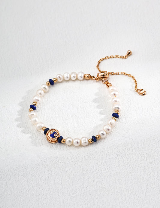 Vintage-style S925 silver bracelet featuring natural pearls and deep blue lapis lazuli gemstones, perfect for elegant boho and zodiac-inspired jewelry collections