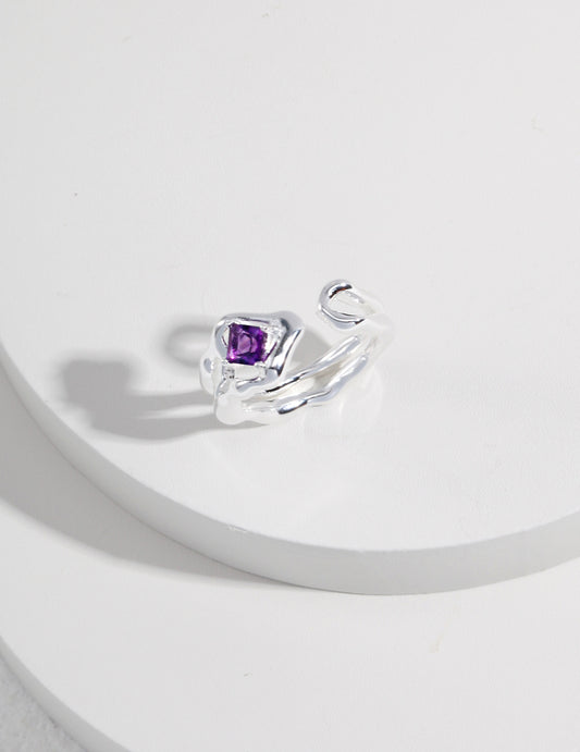 This sterling silver ring features a stunning purple quartz gemstone, offering an elegant and sophisticated design. The rich purple hue of the quartz adds a vibrant touch to the sleek sterling silver band, making it a perfect accessory for both casual and formal occasions. Ideal for those who appreciate high-quality, handcrafted jewelry with a modern, yet timeless appeal.