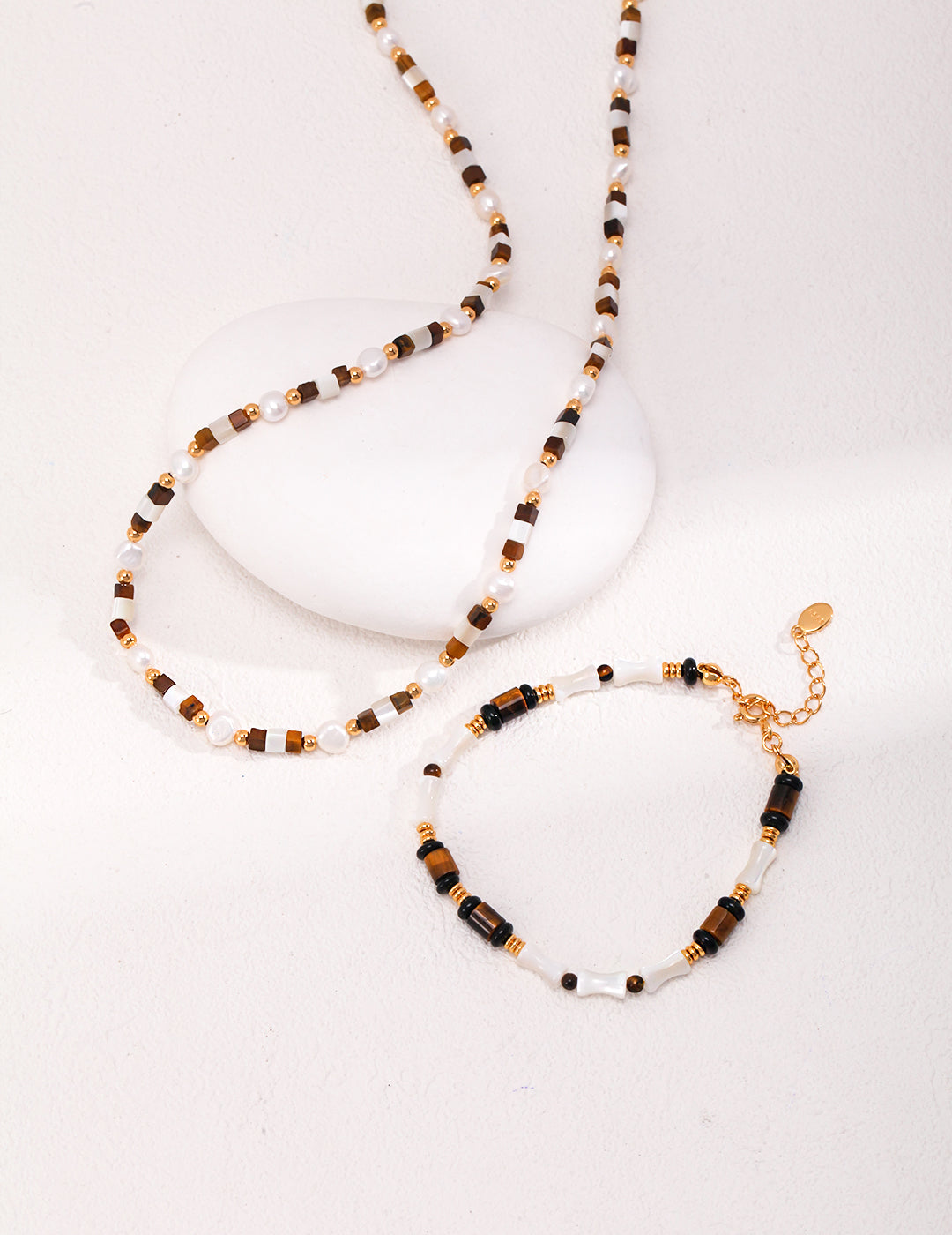 Vintage necklace featuring natural mother of pearl and tiger eye gemstones, symbolizing intuition, protection, and inner strength — a perfect spiritual jewelry piece for women who love boho style and meaningful accessories