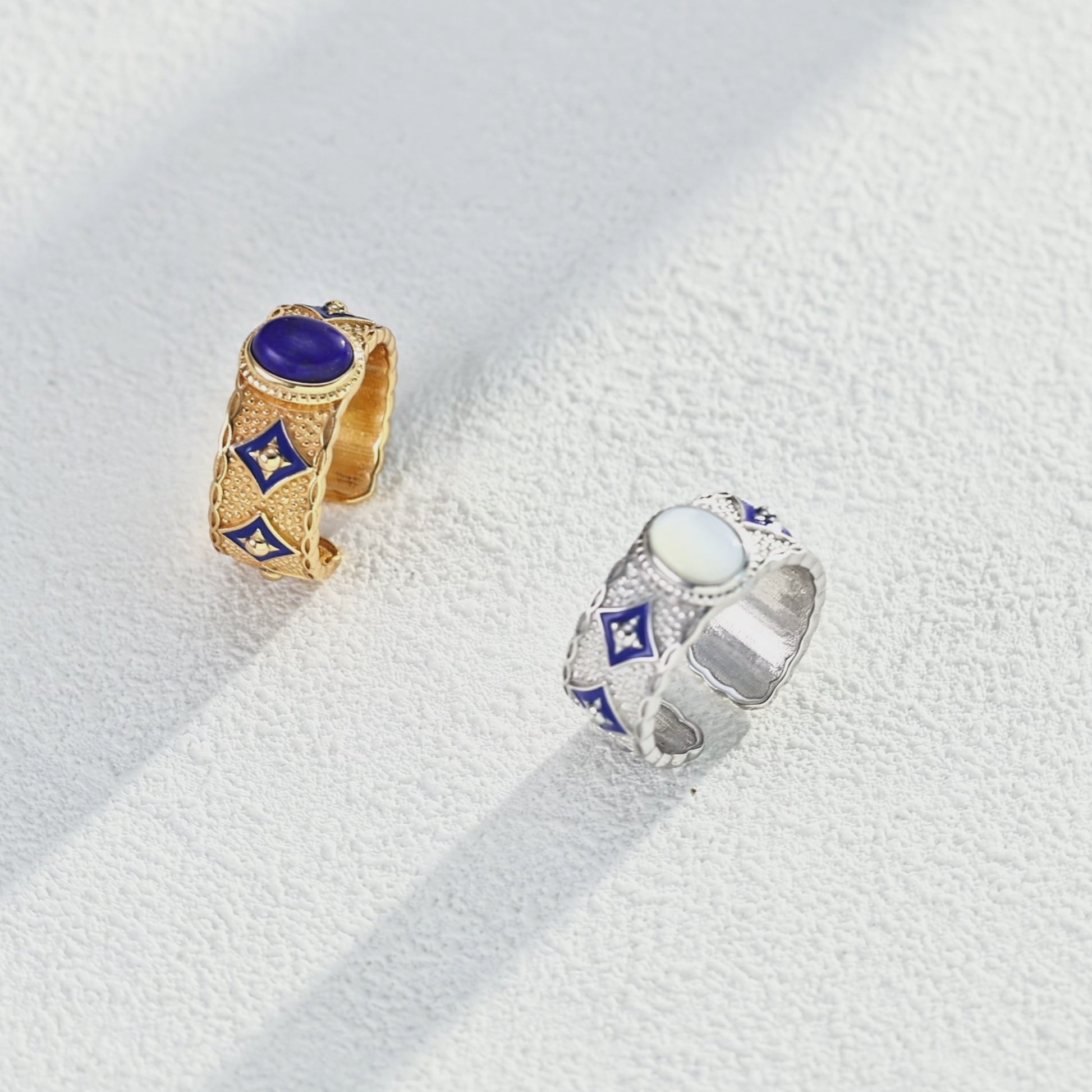 This S925 silver ring features a retro-inspired design with blue enamel, lapis lazuli, and mother of pearl. The vibrant blue hue of lapis lazuli contrasts beautifully with the iridescent glow of mother of pearl, creating a sophisticated, vintage-inspired look perfect for any occasion.